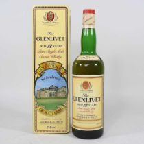 A bottle of The Glenlivet single malt 12 year old whisky, in a classic golf courses St Andrews