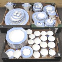 An extensive Palissy Art Deco tea and dinner service, with blue and gilt borders, to include serving