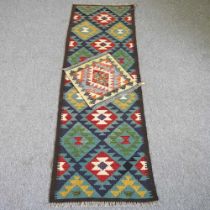 A kilim runner, with hooked diamonds, 47 x 47cm, together with a kilim runner, 212 x 68cm (2)