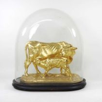 A gilt model of a cow and calf, after Mene, contained under a 19th century glass dome, 45cm high