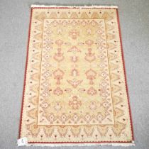 A modern woollen rug, 200 x 134cm, retailed by Harrods