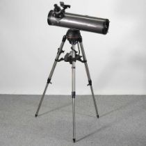 A Celestron NexStar 130SLT stargazing telescope, on a tripod stand, approx 142cm high, with