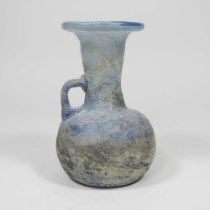 An iridescent blue glass flask, possibly Roman, 12cm high