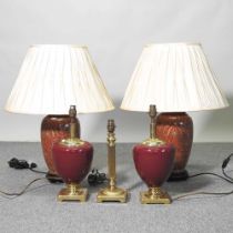 A pair of red pottery table lamps and shades, 64cm high together with three others smaller (5)