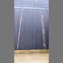 A black painted wrought iron garden arch, 247cm high 110w x 247h cm