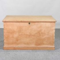 An antique pine trunk, with a hinged lid 98w x 58d x 57h cm