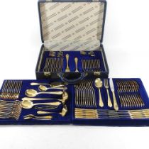 An extensive modern Solingen 24 carat gold plated canteen of cutlery, in a fitted case, with lift