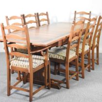 An Ercol extending dining table, together with a set of eight chairs 130w x 113d x 75h cm overall