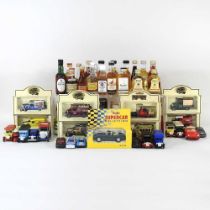 A collection of diecast toy vehicles, some boxed, together with a collection of miniatures, to