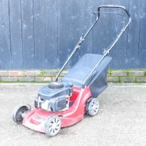 A red Mountfield petrol lawnmower