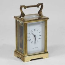 A brass cased carriage clock, by Mappin and Webb Ltd, 12cm high