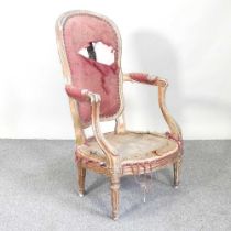 A 19th century French gilt open armchair, on fluted legs