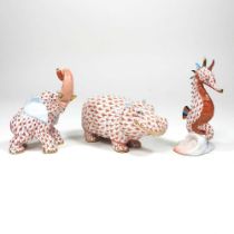 A Herend porcelain model of a seahorse, 10cm high, together with a hippopotamus and an elephant, all