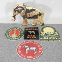A collection of painted metal brewery signs, to include a Fremlins sign in the form of an