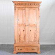 A modern pine single wardrobe, with a drawer below 109w x 59d x 209h cm