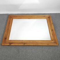 A large pine framed wall mirror, 137 x 105cm