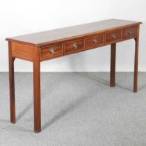 A handmade fruitwood side table, containing five short drawers, on square legs 155w x 37d x 76h cm