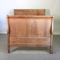 An early 20th century French oak sleigh bed, 117cm wide