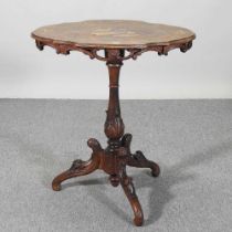 A 19th century Italian walnut marquetry occasional table, with an inlaid shaped tilt top, on a