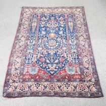 A Persian rug, with foliate designs on a blue ground, 213 x 140cm