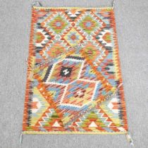 A kilim rug, with all over hooked diamonds, 118 x 80cm, together with another 52 x 47cm (2)