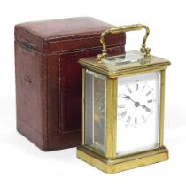 An early 20th century French brass cased carriage clock, 10cm high, in a leather case