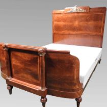 A mid 20th century French mahogany and burr walnut double bedstead, with ornate gilt metal mounts,