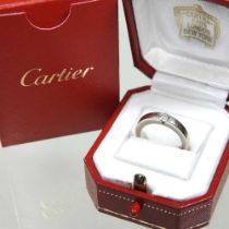 A Cartier 18 carat white gold solitaire diamond ring, approximately 0.21 carats, 4.8g, size G,