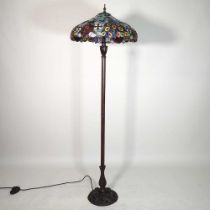 A Tiffany style standard lamp, with a stained glass shade, 160cm high overall