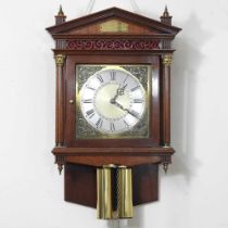 A hand made hood clock, with a striking twin weight driven movement, bearing a plaque for Lawrence