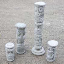 Four cast stone garden statues of totem poles, largest 82cm high (4)