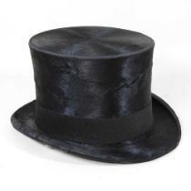 An early 20th century silk top hat, size approximately 20 x 16cm