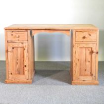 A modern pine pedestal desk 126w x 64d x 79h cm