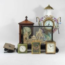A collection of various clocks, together with an oriental cork picture, in a glazed case, 40cm