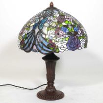 A Tiffany style table lamp, with a stained glass shade, 57cm high overall
