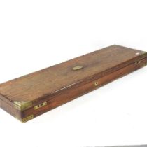 A Victorian oak and brass mounted gun case, the fitted interior bearing a paper label for William