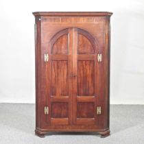 A George III mahogany and inlaid corner cabinet, on bracket feet 90w x 51d x 140h cm