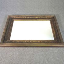 A large modern gilt framed wall mirror, 123 x 43cm