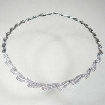 An 18 carat white gold diamond necklace, of wave design, approximately 5.0 carats gross, 37g, 42cm