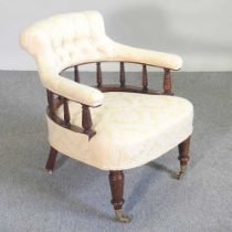A Victorian yellow upholstered armchair