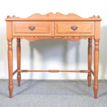 A pine side table, with a gallery back and two short drawers 87w x 46d x 85h cm