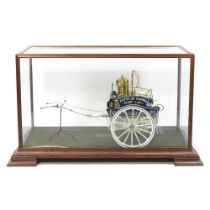 A scratch built painted wooden model of a dairy cart of circa 1900, in a glazed wooden display case,