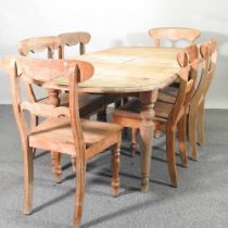 A pine extending dining table, together with a set of six light oak bar back dining chairs (7)