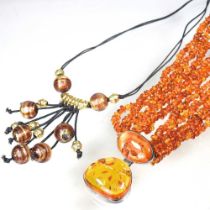 A silver and amber bead necklace, boxed, together with a Murano necklace, with glass beads (2)