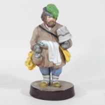 A Russian Gardner biscuit porcelain figure, of a tea and bagel vendor, red factory stamp and