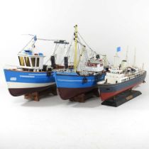 A model of a fishing trawler, 44cm long, together with another and an ocean liner (3)