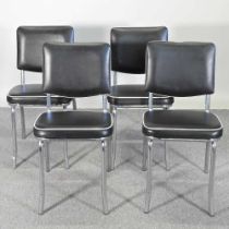 A set of four contemporary black upholstered dining chairs, with white piping, on chrome legs (4)