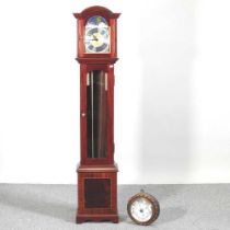 A granddaughter clock, together with an early 20th century aneroid barometer, with a ropetwist