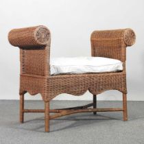 A wicker window seat, with a cushion seat 94w x 46d x 77h cm