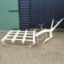 A vintage farm plough, 220cm long, together with a wooden harrow (2)